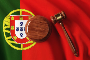 Gavel On Portuguese Flag: Portuguese Constitution and Justice Concept